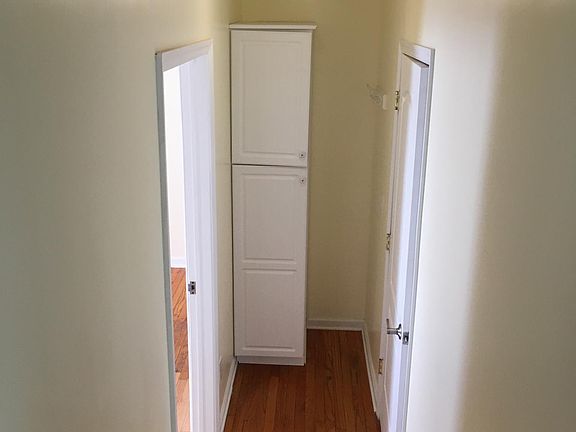 Hallway with extra storage cabinet