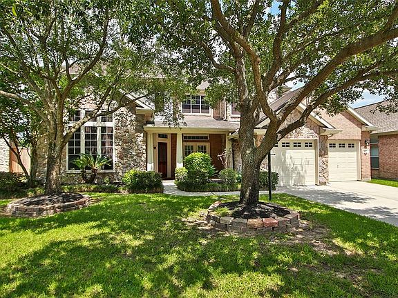 The large shady trees in the front are pretty and keep things cool.