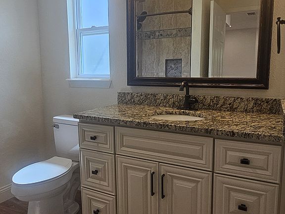 Master bath with upgraded soft-close cabinetry, bronze hardware, granite counters, and upgraded lighting
7.5x8