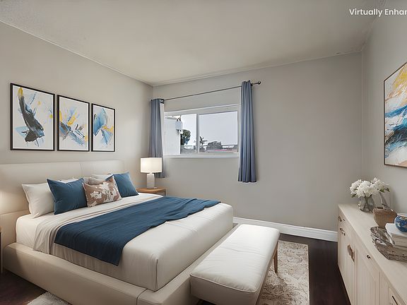 bedroom 2 with virtual stage. additional assigned parking next to the bedroom window per request