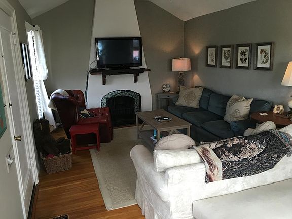 Spanish coved ceiling, hardwood floors and fireplace