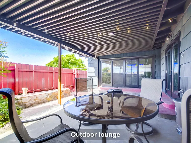 This spacious outdoor lounge is perfect for sunny get-togethers or evening BBQs