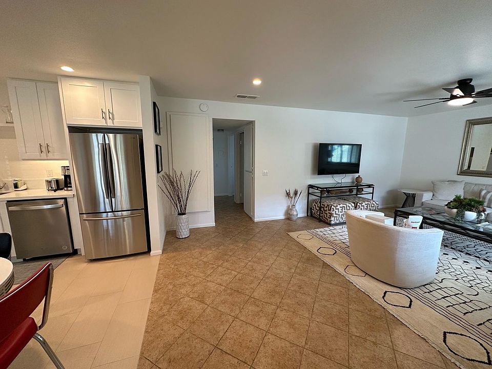 Entry into open concept kitchen and living area