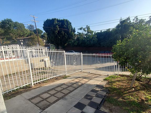 Looking towards the outside. Gated driveway for a single car. A peaceful and walkable neighborhood.