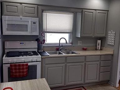 5 burner stove and stainless steel Kohler sink and faucet