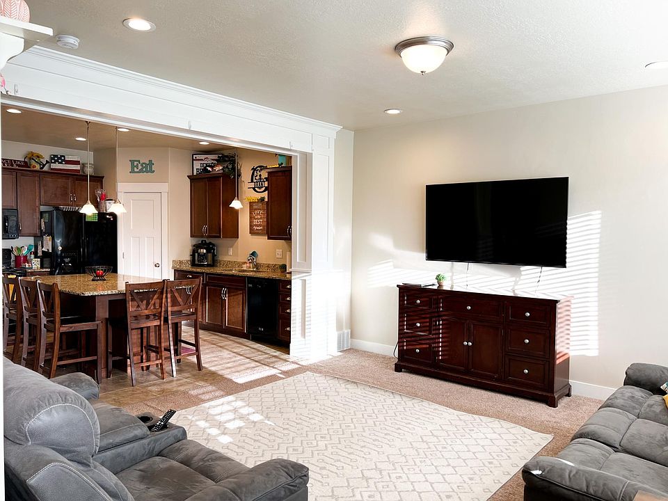 Open concept Family Room/Kitchen with large bar. Custom millwork in unit.