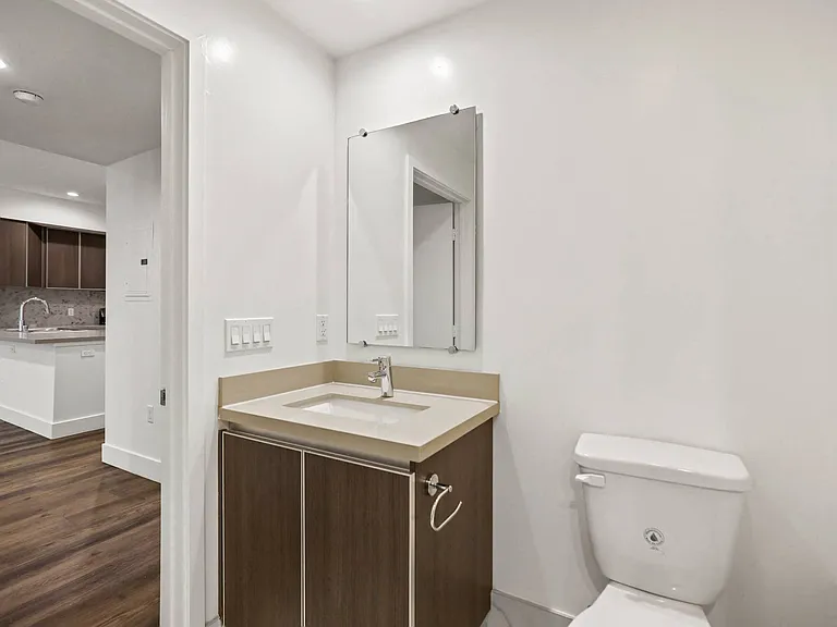 Hallway Half-Bath with Cabinet Storage
