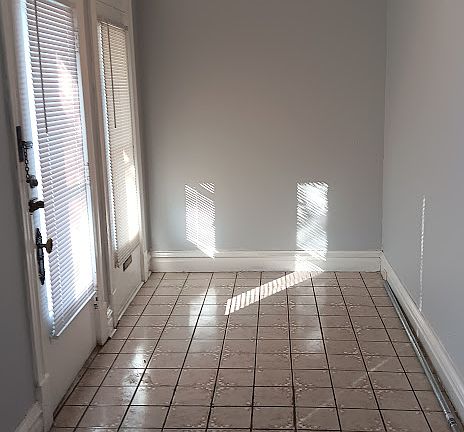 Large front entry way. Room for small desk, Coat rack, Lamp.