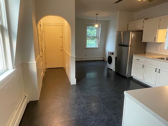 Back hall entrance into kitchen. Kitchen closet is located off the hallway after entering from back door.