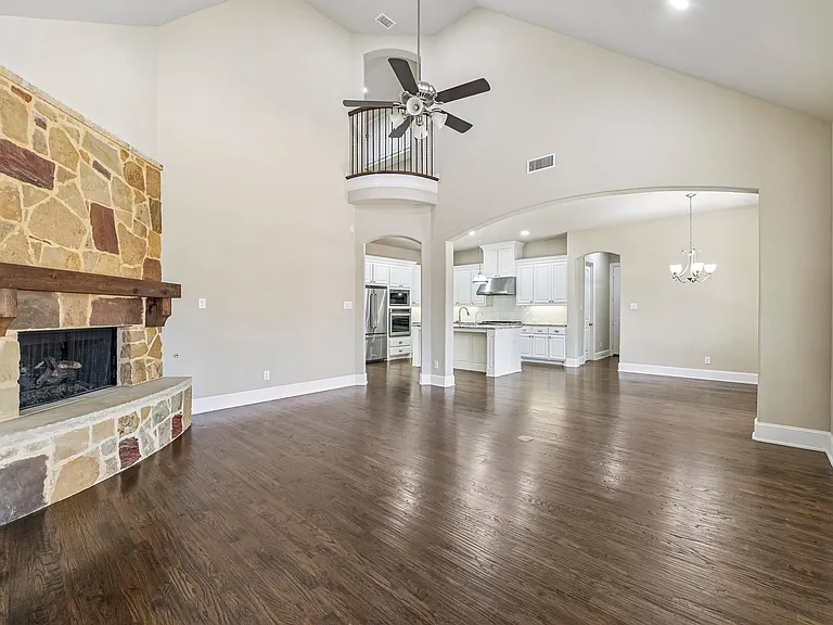 Family room with added cozy gas fireplace. LOVE LOVE LOVE the wood floors.