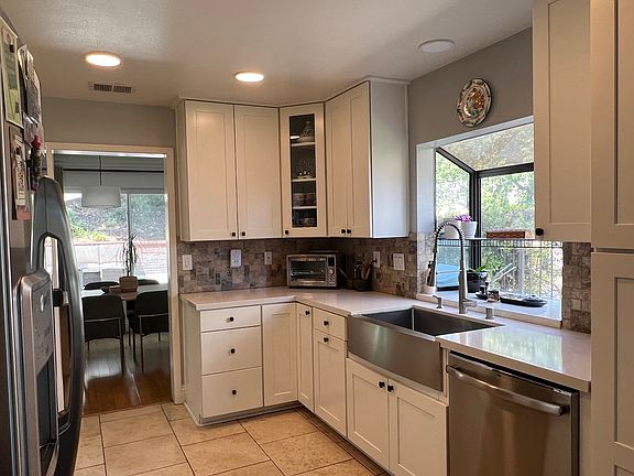 Kitchen with quartz counters and stainless steel appliances