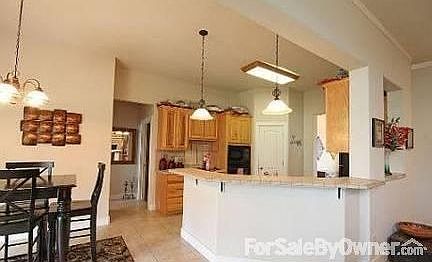 Kitchen and Breakfast Area
						:
						View from Living Area