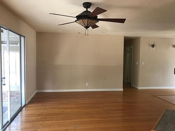 Living room/Sliding door access to bonus sunroom