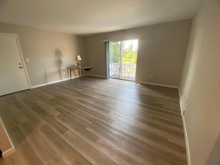 Entry door into great room with balcony, with green space view!