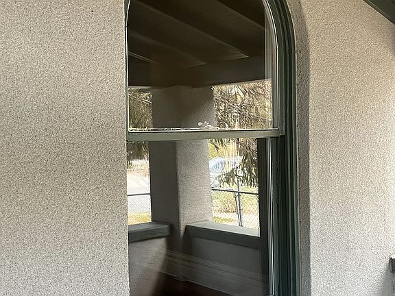 Arched window on front of house