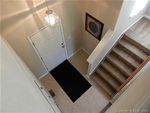 Foyer & steps to bedrooms