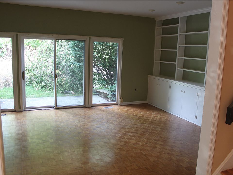 Family room with built-in bookcase and slider to patio