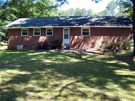 Back exterior with brick patio