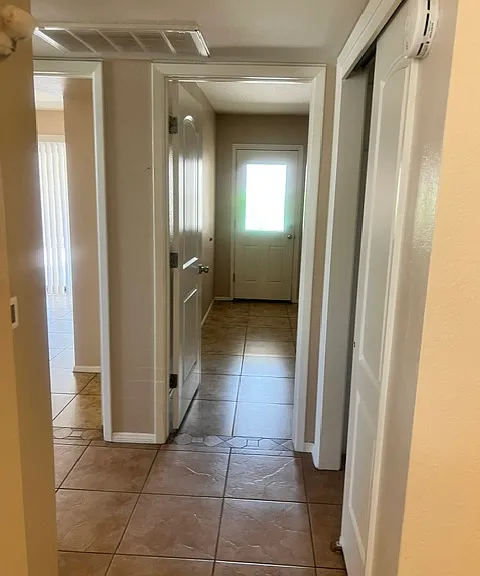 Hall to Bedroom 2 (straight ahead) and Bedroom 1 to the Left