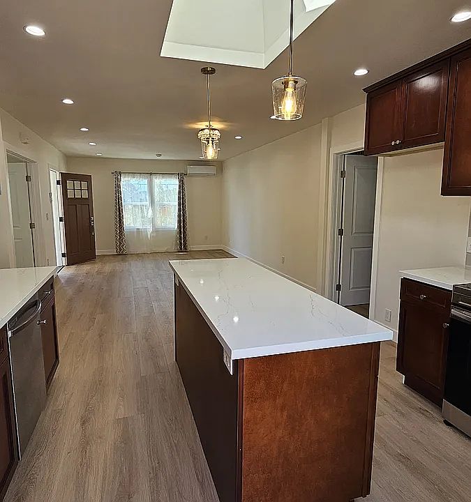 Complete remodel with all new finishes and fixtures. Kitchen/dining room/living room view from deck.