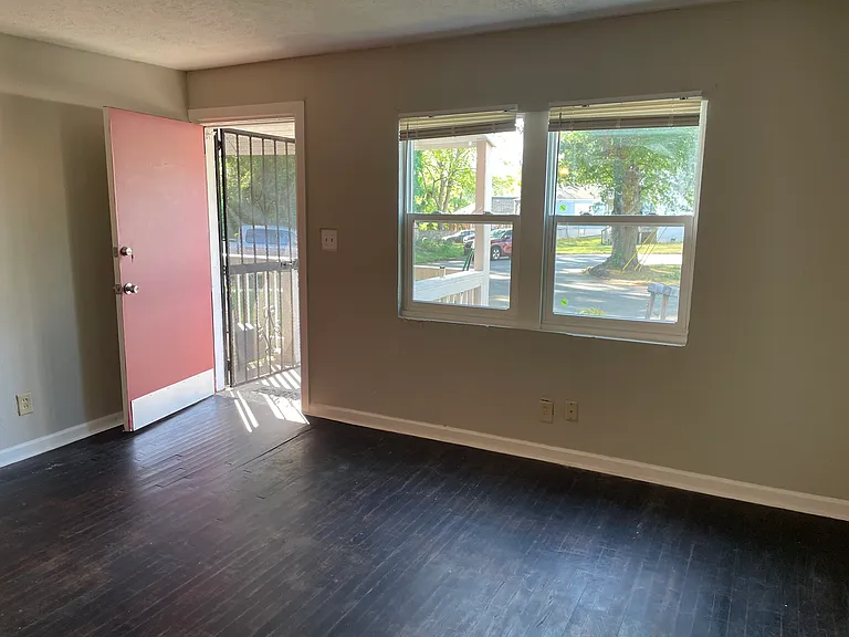 living room and front door to porch