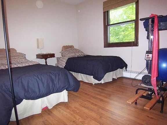 bedroom with wood floors