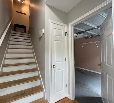 Main Entrance to the property - the living space is right up the stairs. There is a coat closet and the garage is to the right where you'll have access to the laundry area and 3rd bedroom/flex space
