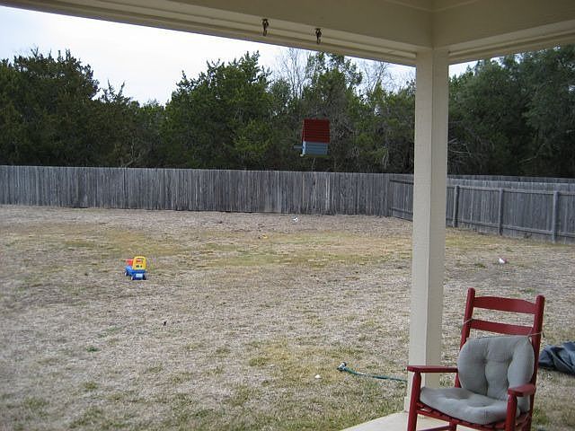1/3 of an acre backyard! Covered porch w/ceiling fan.