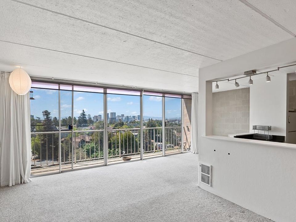 Main Living room with amazing floor to ceiling view of Bay, SF and Downtown Oakland