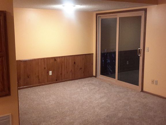 Downstairs patio door and living room.