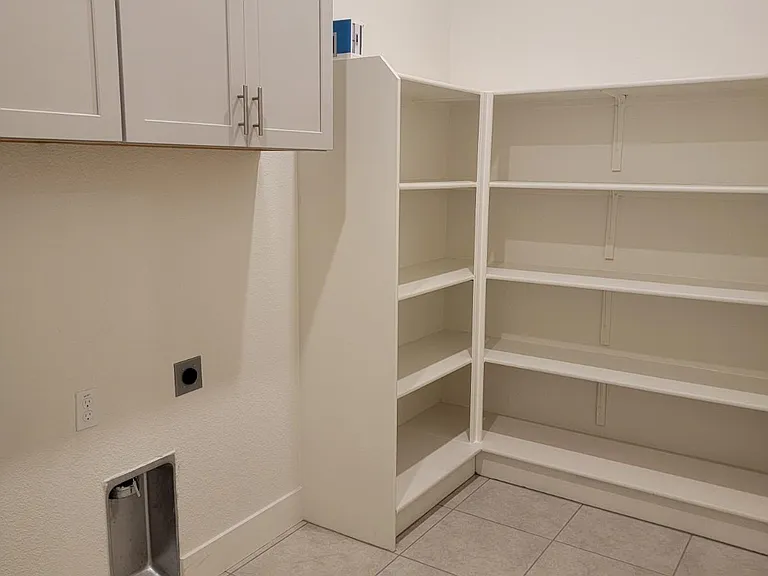 LAUNDRY/UTILITY ROOM. NOT SHOWN: WASH SINK & WASHER DRYER SET