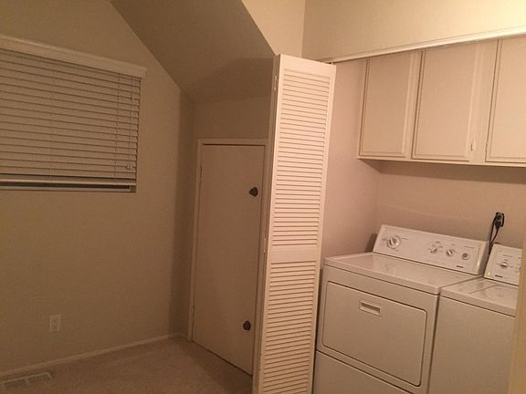 Laundry room + extra room with 2 closets, room for desk or?