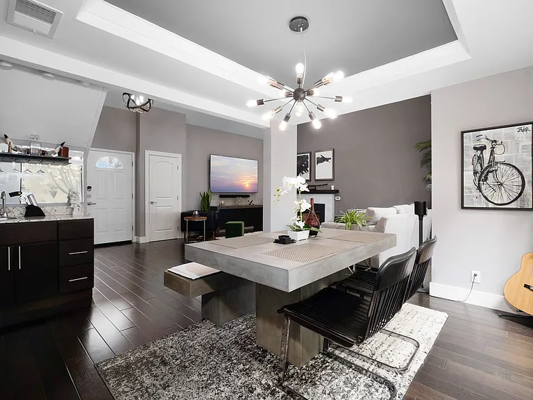 Modern concrete dining table w/mini bar. Dine in style while watching your fav TV/Sports/Movies.