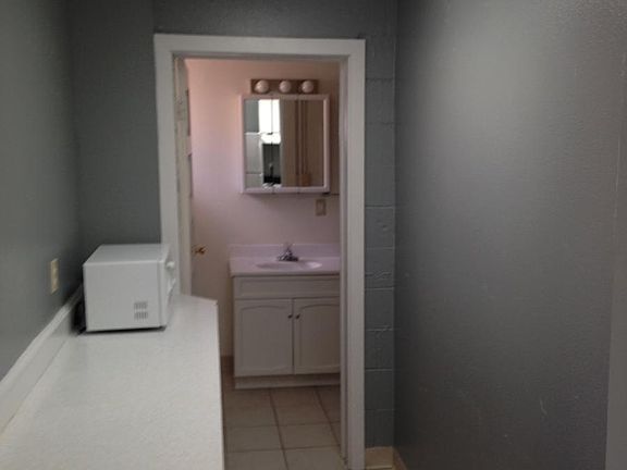 Kitchen hallway leading to bathroom