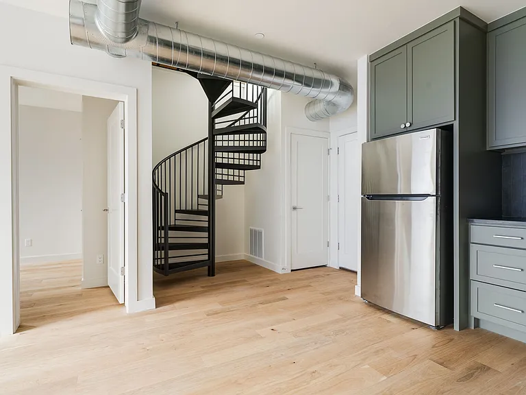 Kitchen and view of spiral staircase to upstairs terrace