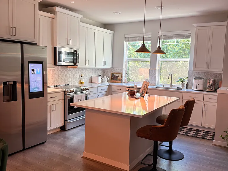 Kitchen includes Samsung smart refrigerator with touchscreen