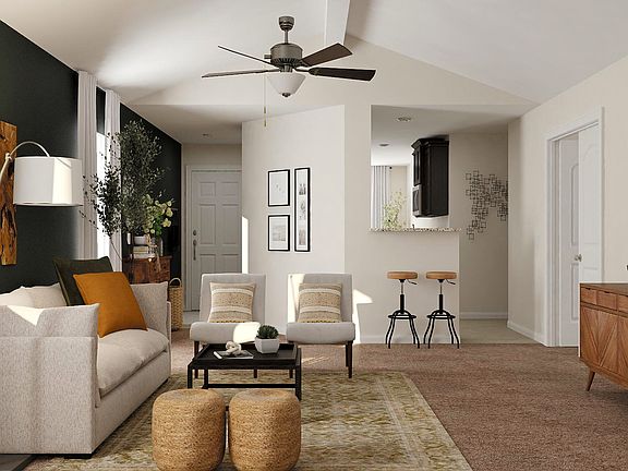 Vaulted ceilings in the expansive family add unique personality to this appealing floor plan.