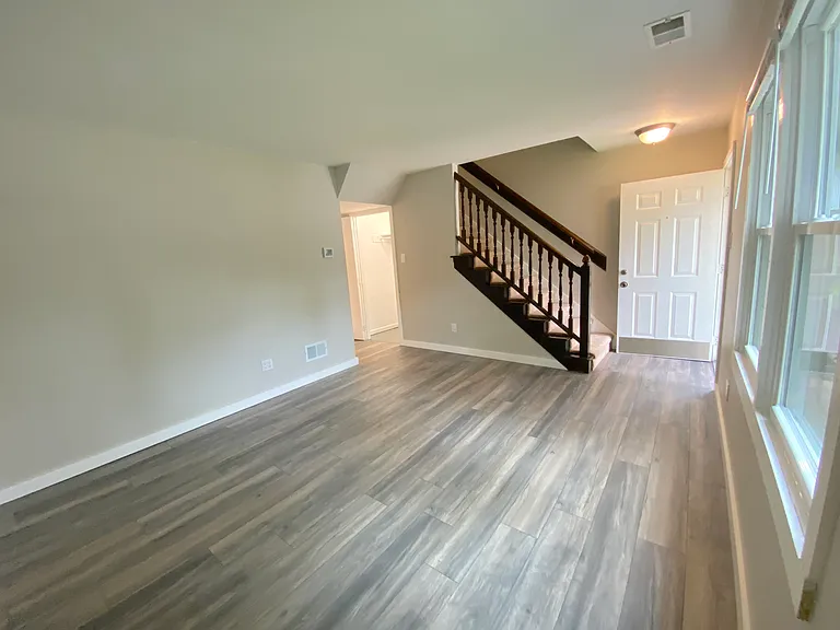 Living room full view of large storage closet and front door
Wood floors and energy-efficient windows