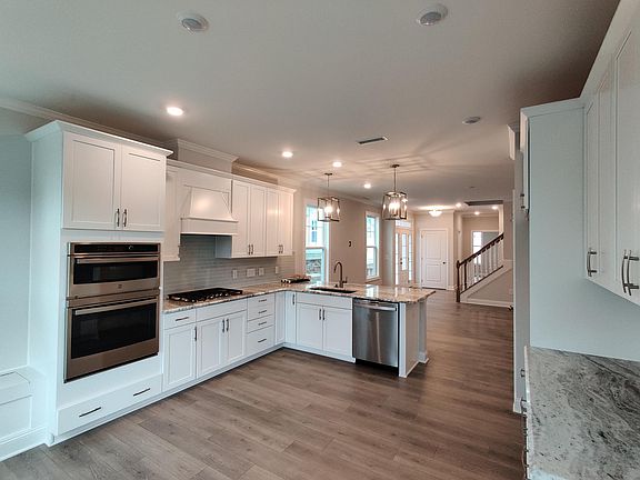 View of kitchen and living from dining nook