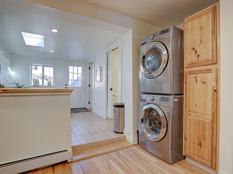 Laundry area with full size washer and dryer.