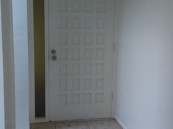 Looking at Front Door From Inside of Home