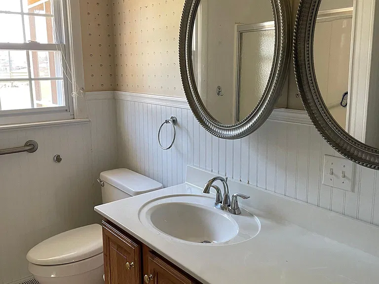 Double Mirror Medicine Cabinets. Oak vanity with lots of room for storage.