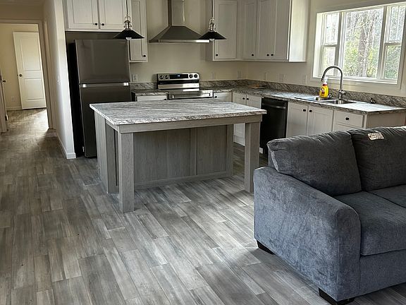 Spacious kitchen with large island. Comes with brand new refrigerator, dishwasher, and stove.