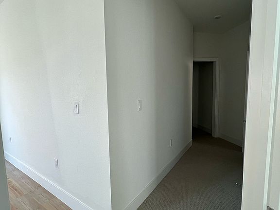 walkway to bedrooms and bathroom
