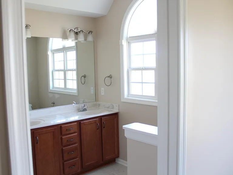 Master Bathroom with white tile floors.