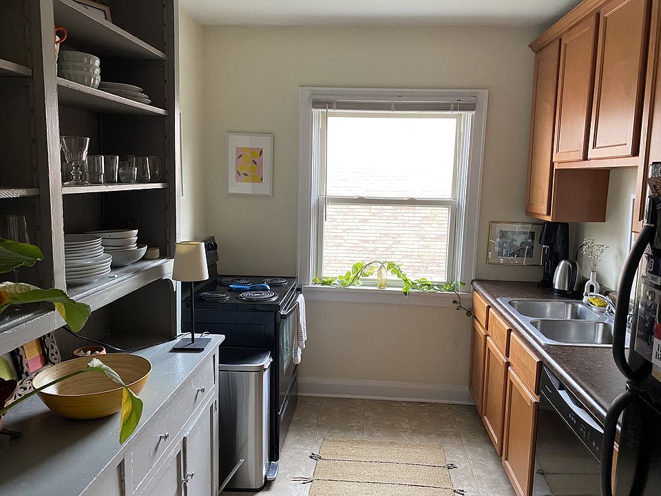Kitchen w built-in shelves & dishwasher