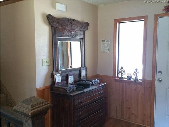 Stairway up to living, dining and kitchen.