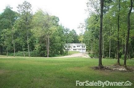 Nestled on a wooded lot
						:
						Close to everything yet private