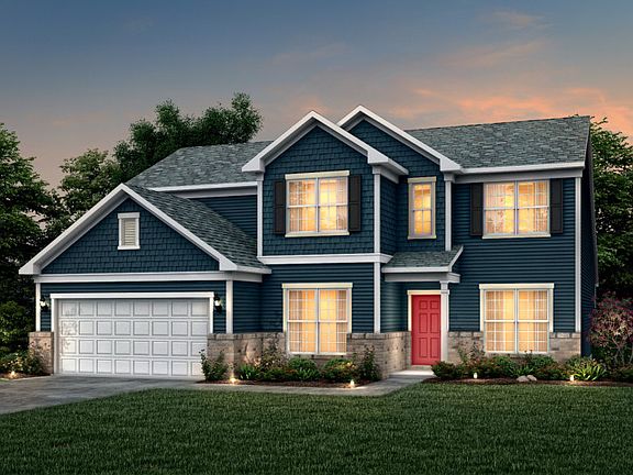 Vanderbilt Exterior 2 features Hardie Board siding, shakes, brick, covered front door and 2 car gara