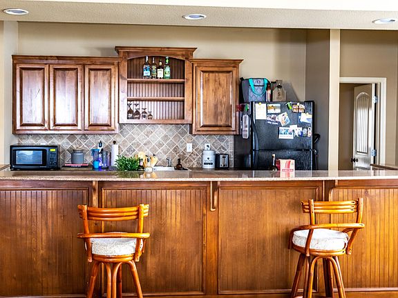 Warm and open kitchen is perfect for meals made at home or entertaining.